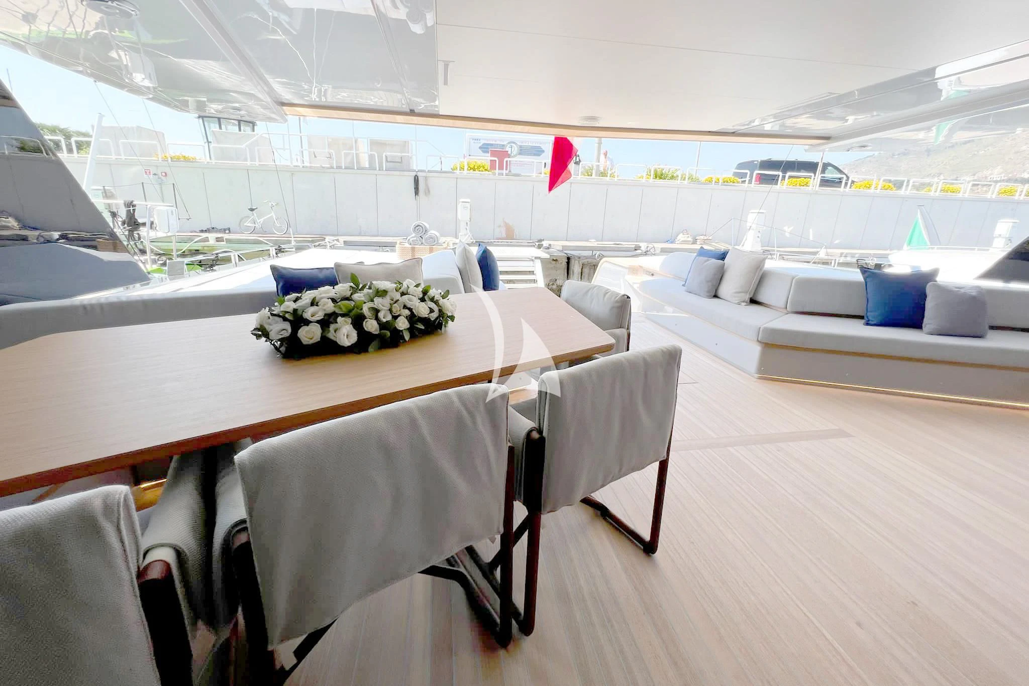 a room with tables and chairs aboard BAD MUTHA Yacht for Sale