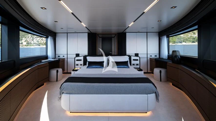 a large bedroom with a large bed aboard BAD MUTHA Yacht for Sale