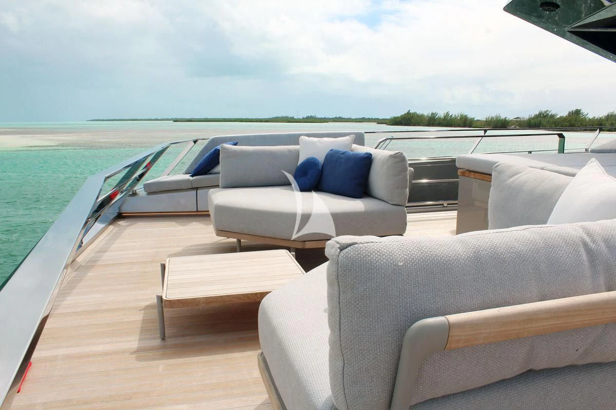 a deck with a pool and a couch aboard BAD MUTHA Yacht for Sale