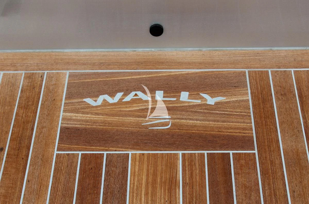 a wood surface with a white and black design on it aboard BAD MUTHA Yacht for Sale