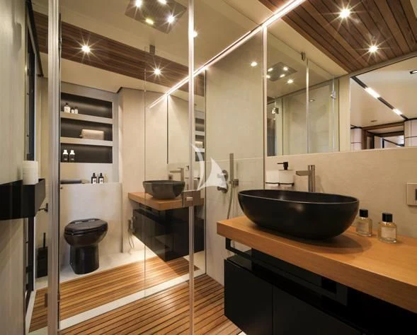 a bathroom with a sink and a toilet aboard BAD MUTHA Yacht for Sale
