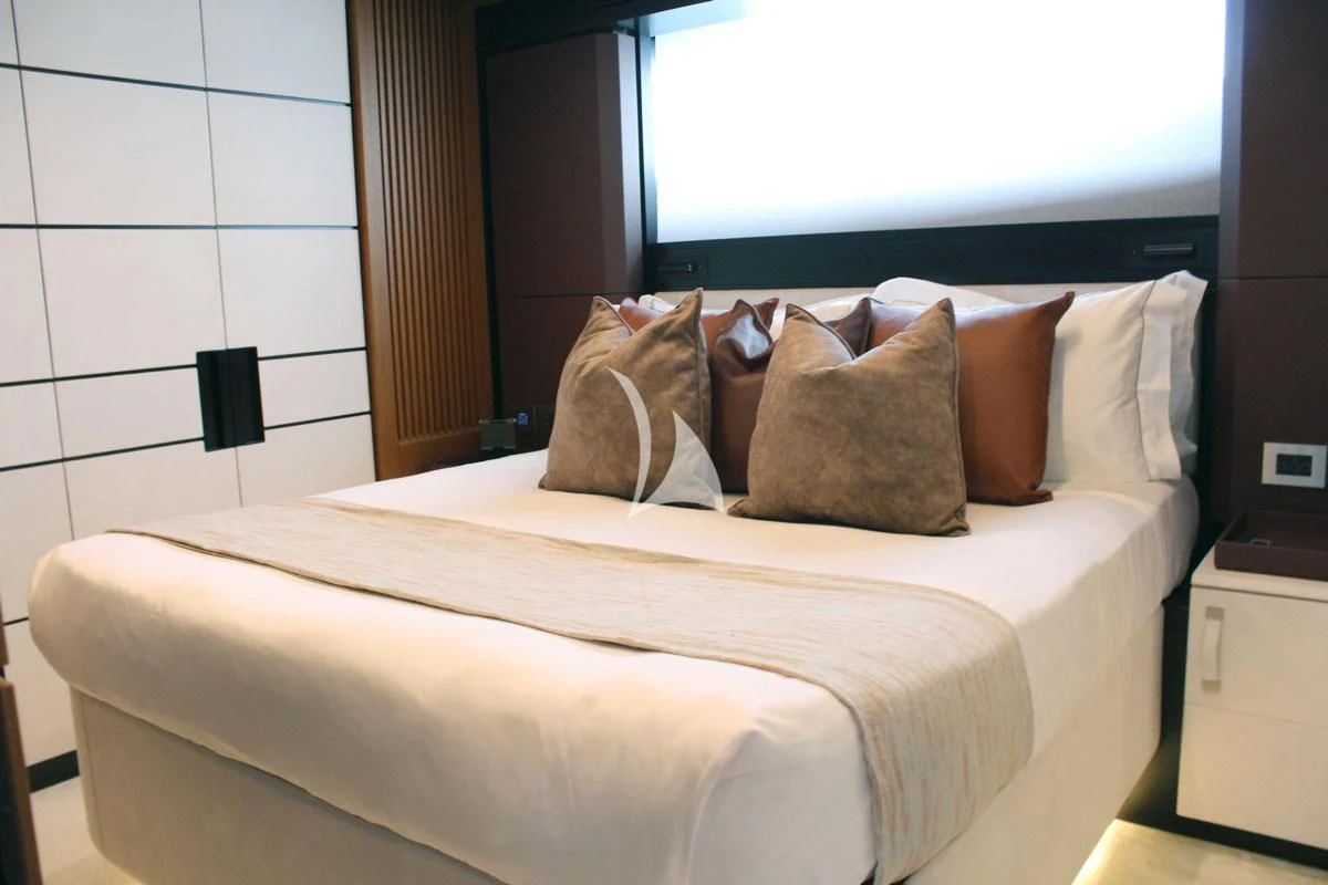 a bed with pillows aboard BAD MUTHA Yacht for Sale