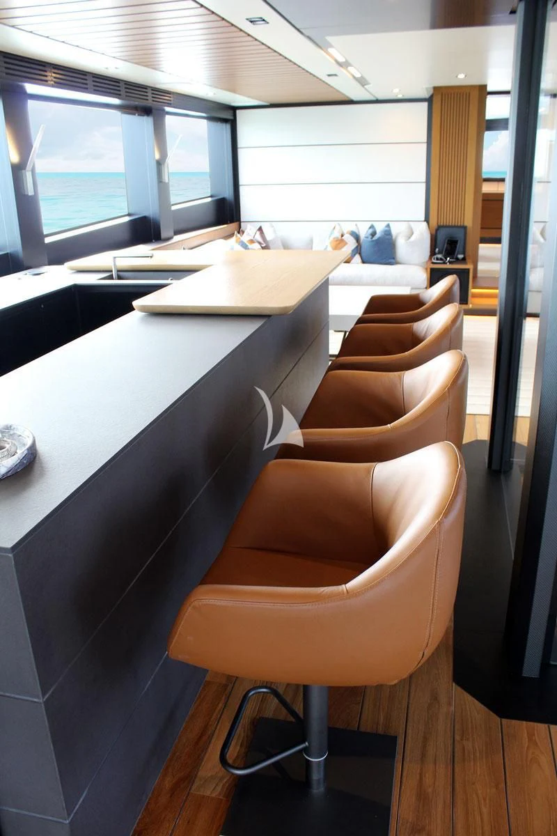 a room with a desk and a window aboard BAD MUTHA Yacht for Sale