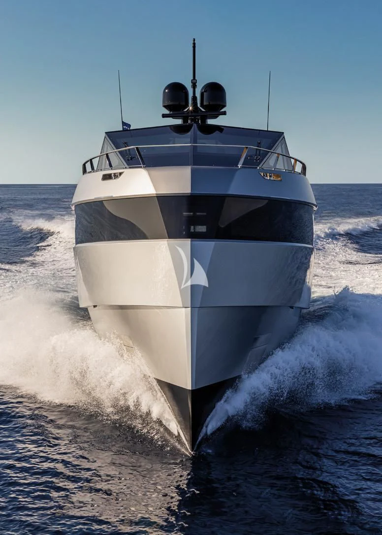 a white boat in the water aboard BAD MUTHA Yacht for Sale