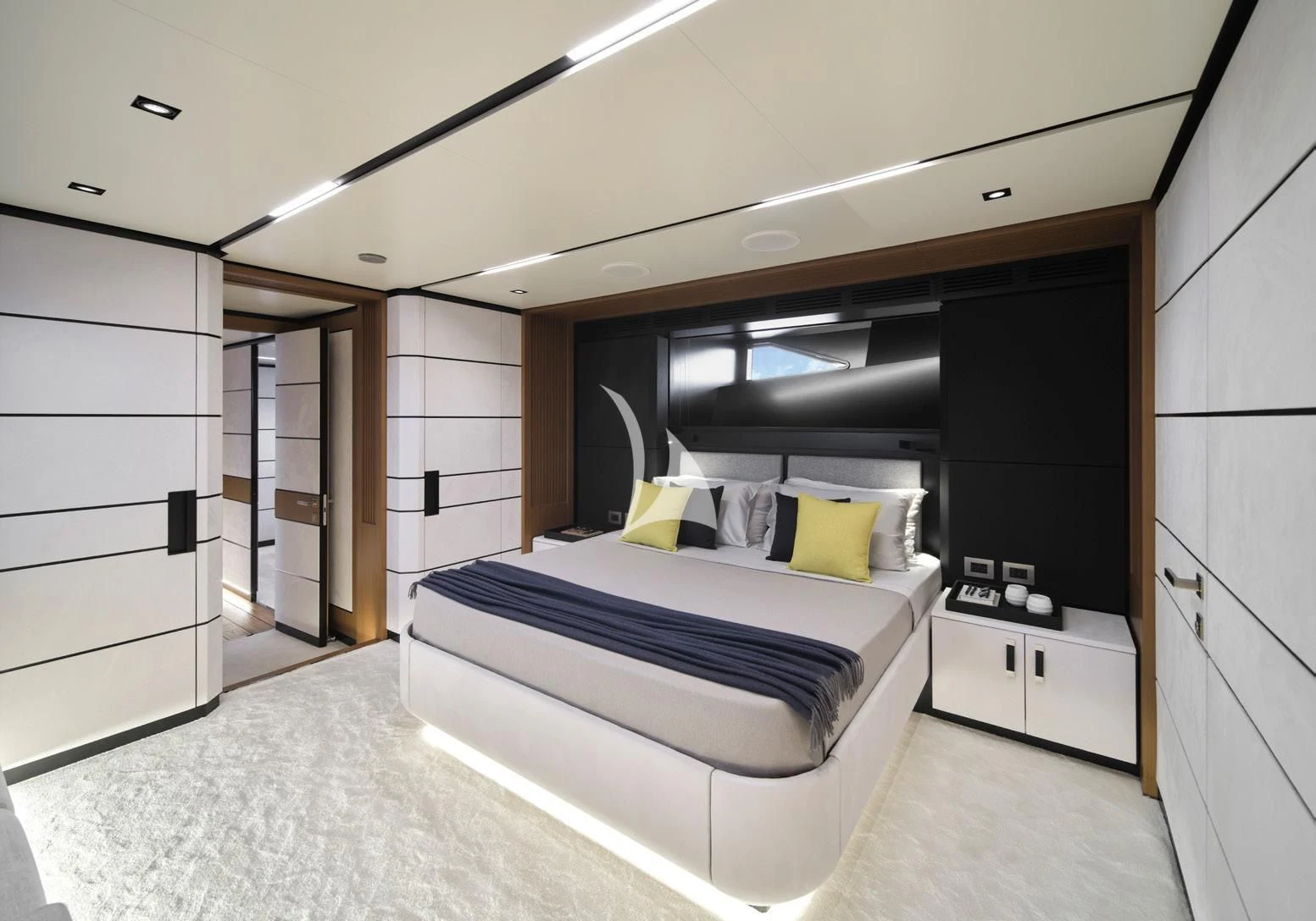 a room with a bed and cabinets aboard BAD MUTHA Yacht for Sale