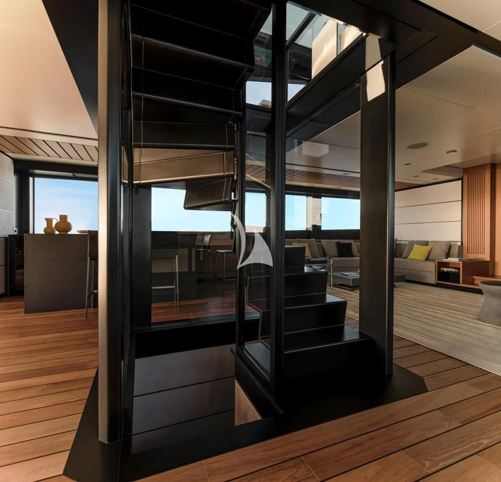 a room with glass walls and a wood floor aboard BAD MUTHA Yacht for Sale