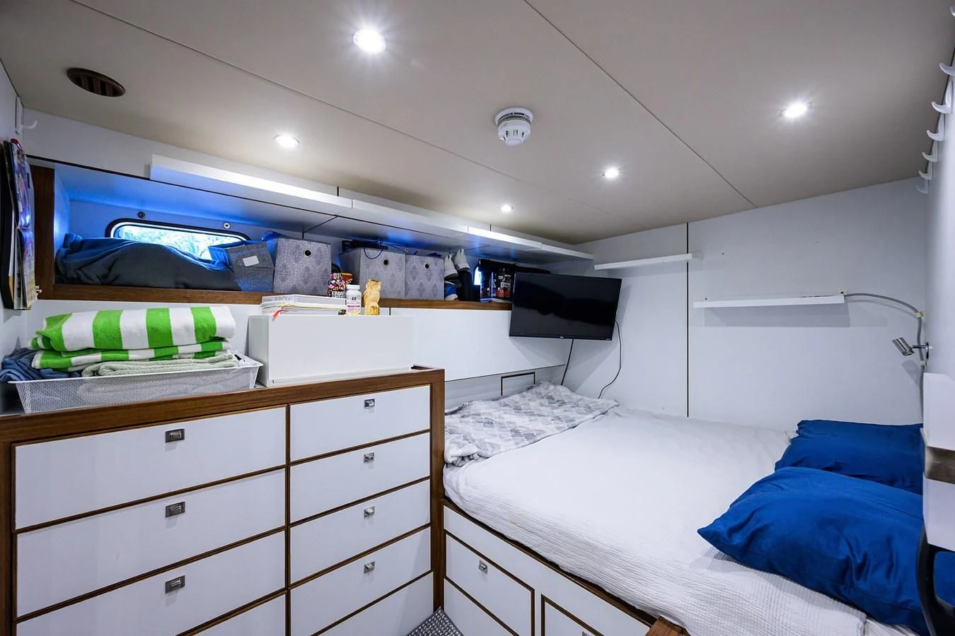 a room with white bunk beds aboard LACEY KAY Yacht for Sale