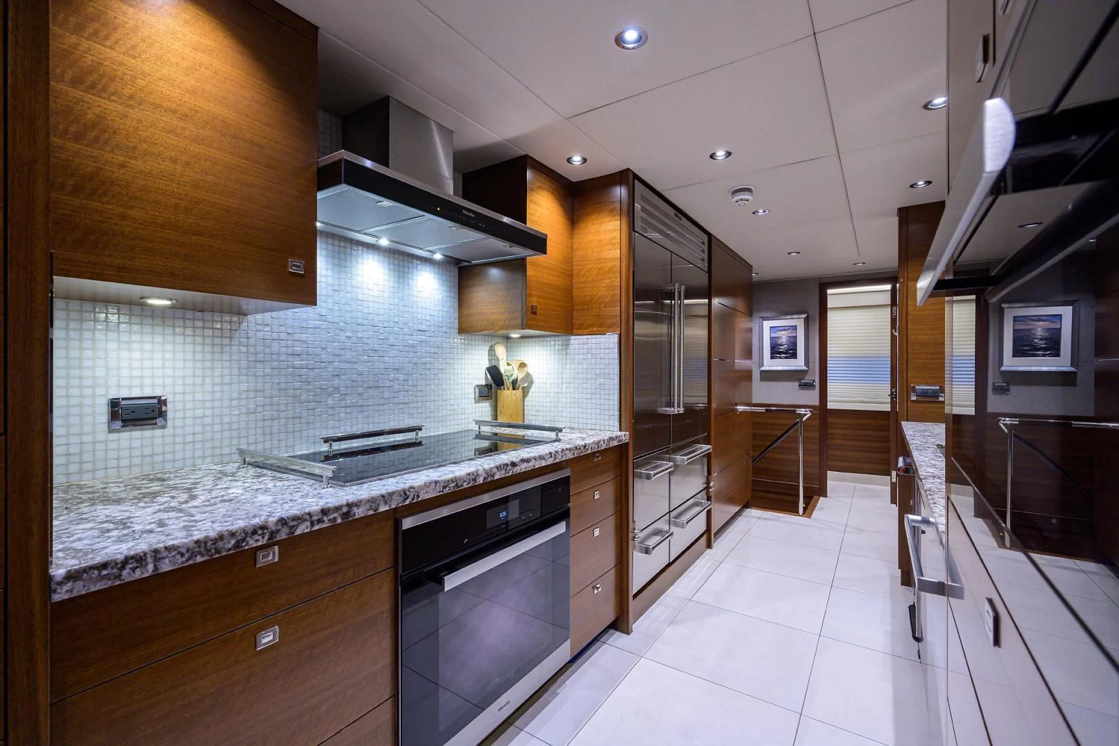 a kitchen with a large island aboard LACEY KAY Yacht for Sale
