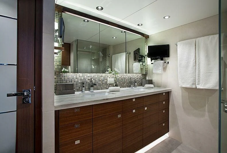 a bathroom with a large mirror aboard LACEY KAY Yacht for Sale