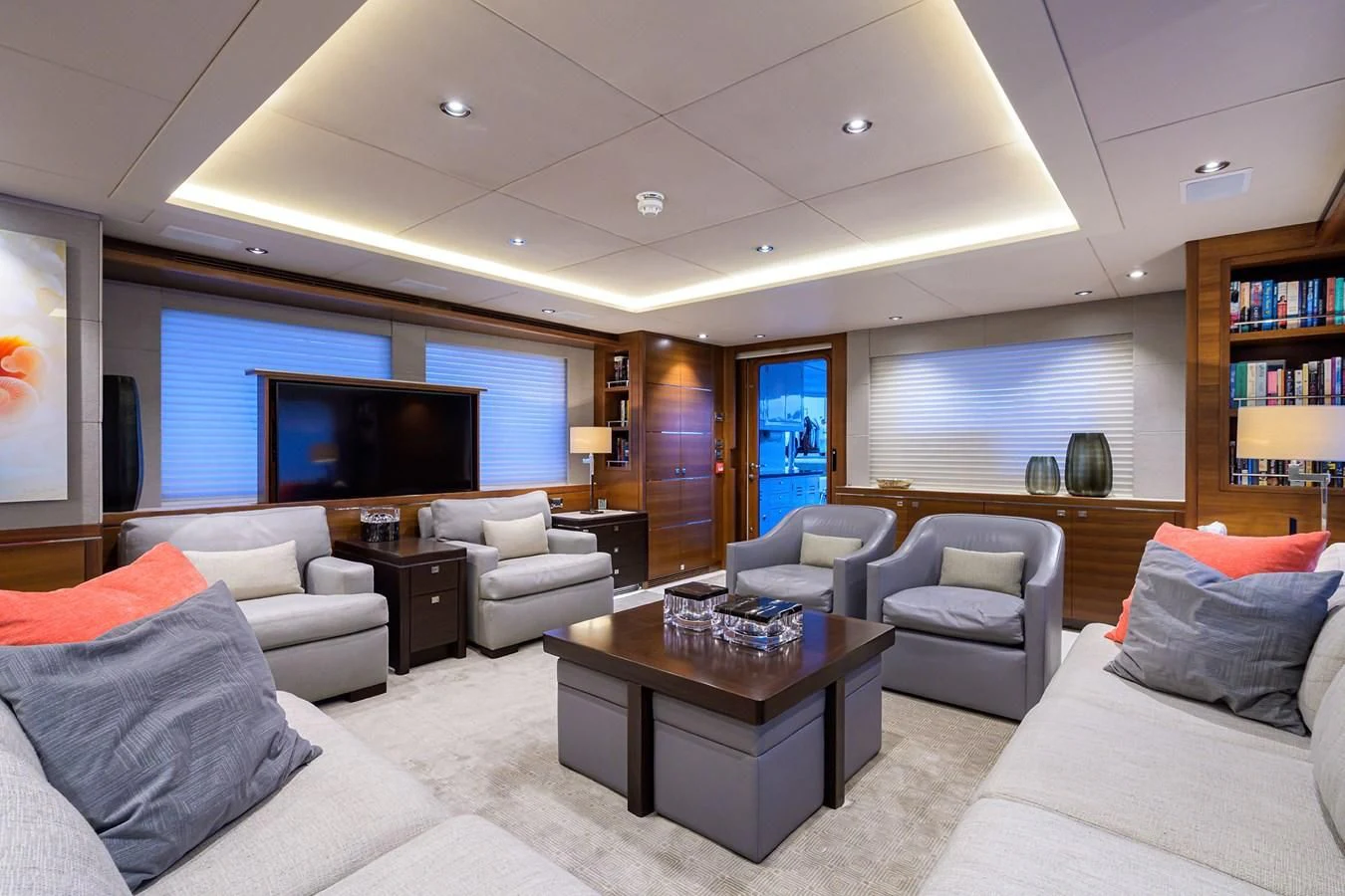 a living room with a large screen aboard LACEY KAY Yacht for Sale