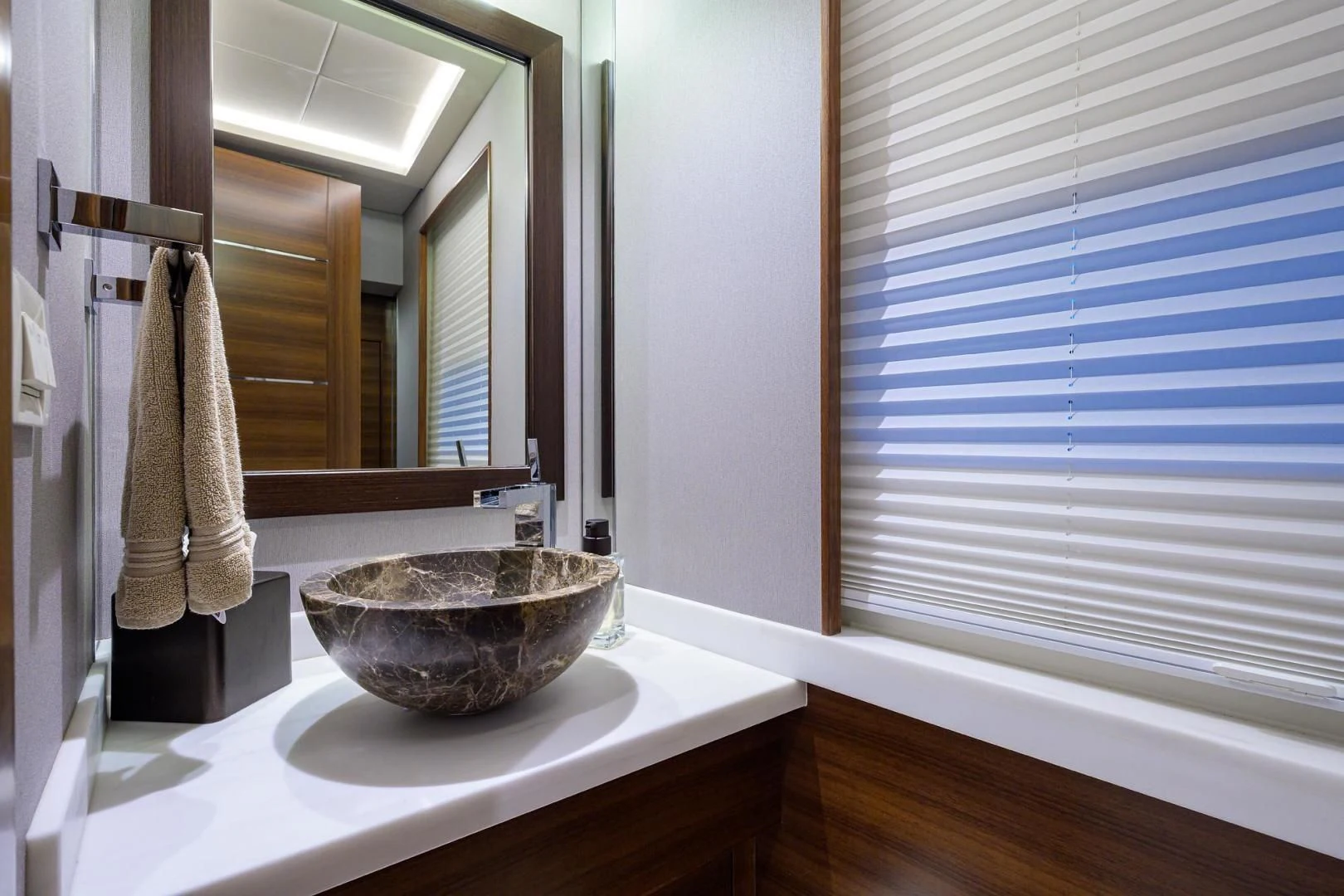 a bathroom with a sink and a mirror aboard LACEY KAY Yacht for Sale