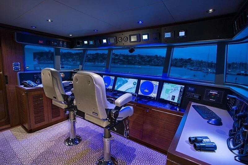 a room with a desk and chairs aboard LACEY KAY Yacht for Sale