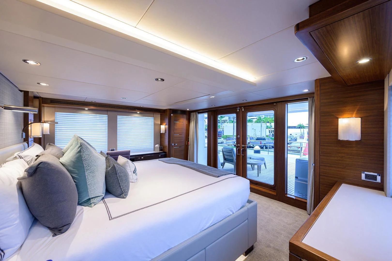 a room with a bed and a table aboard LACEY KAY Yacht for Sale