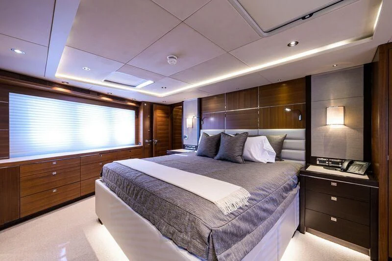 a room with a bed and a window aboard LACEY KAY Yacht for Sale
