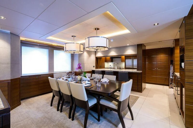 a large kitchen with a dining table aboard LACEY KAY Yacht for Sale