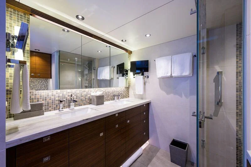 a bathroom with a large mirror aboard LACEY KAY Yacht for Sale