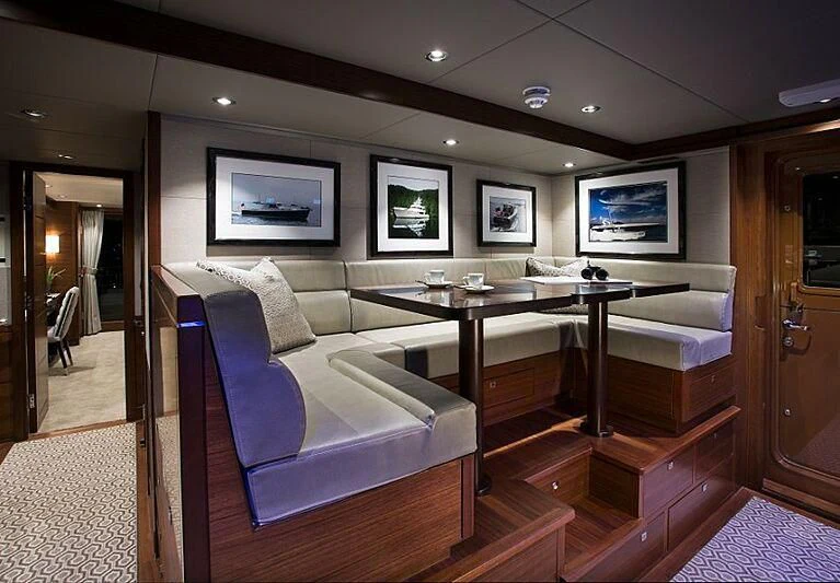 a living room with a couch and a table aboard LACEY KAY Yacht for Sale