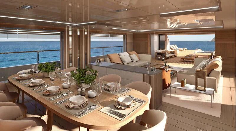 a large room with a table and chairs aboard BOW SPRIT Yacht for Sale