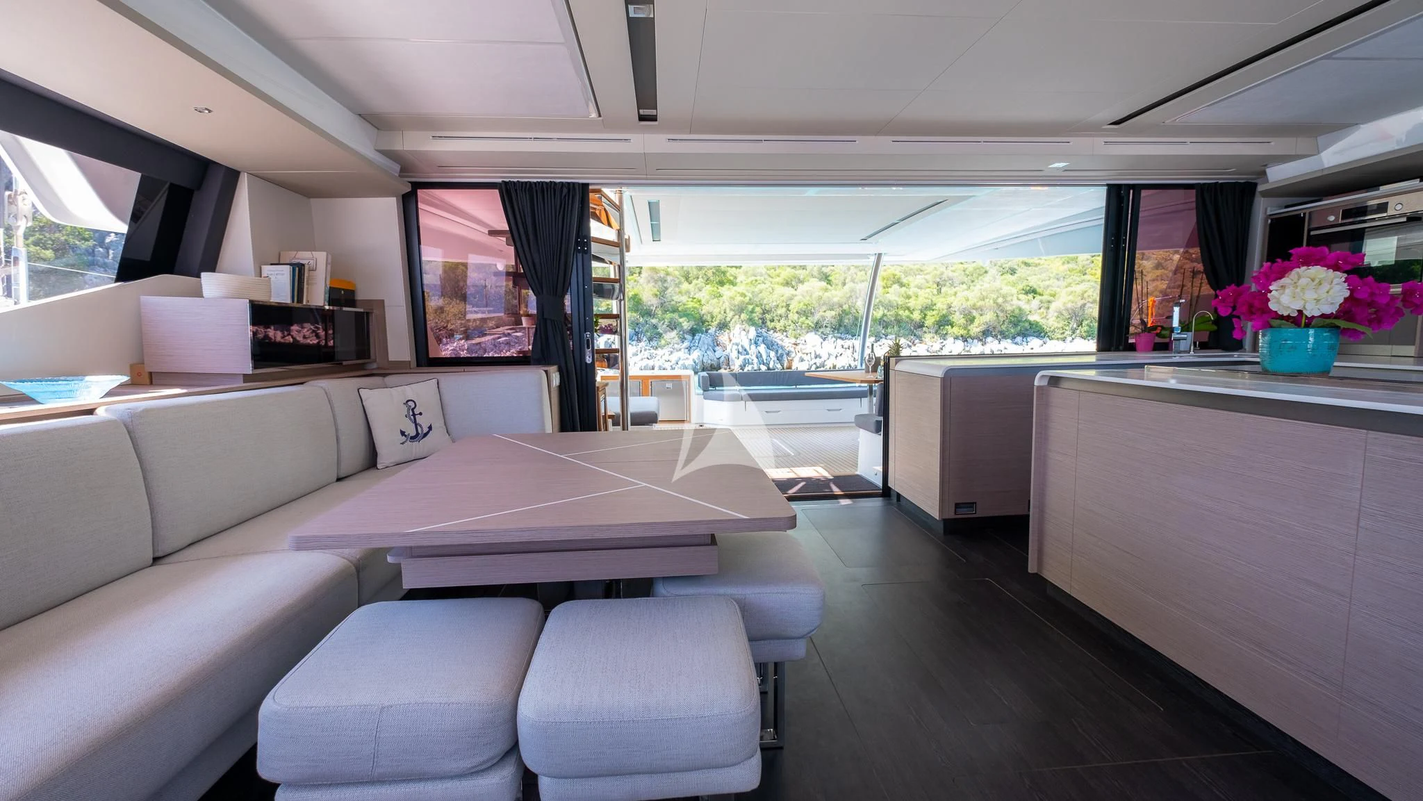 a room with a couch and a table aboard MUS 3 Yacht for Charter