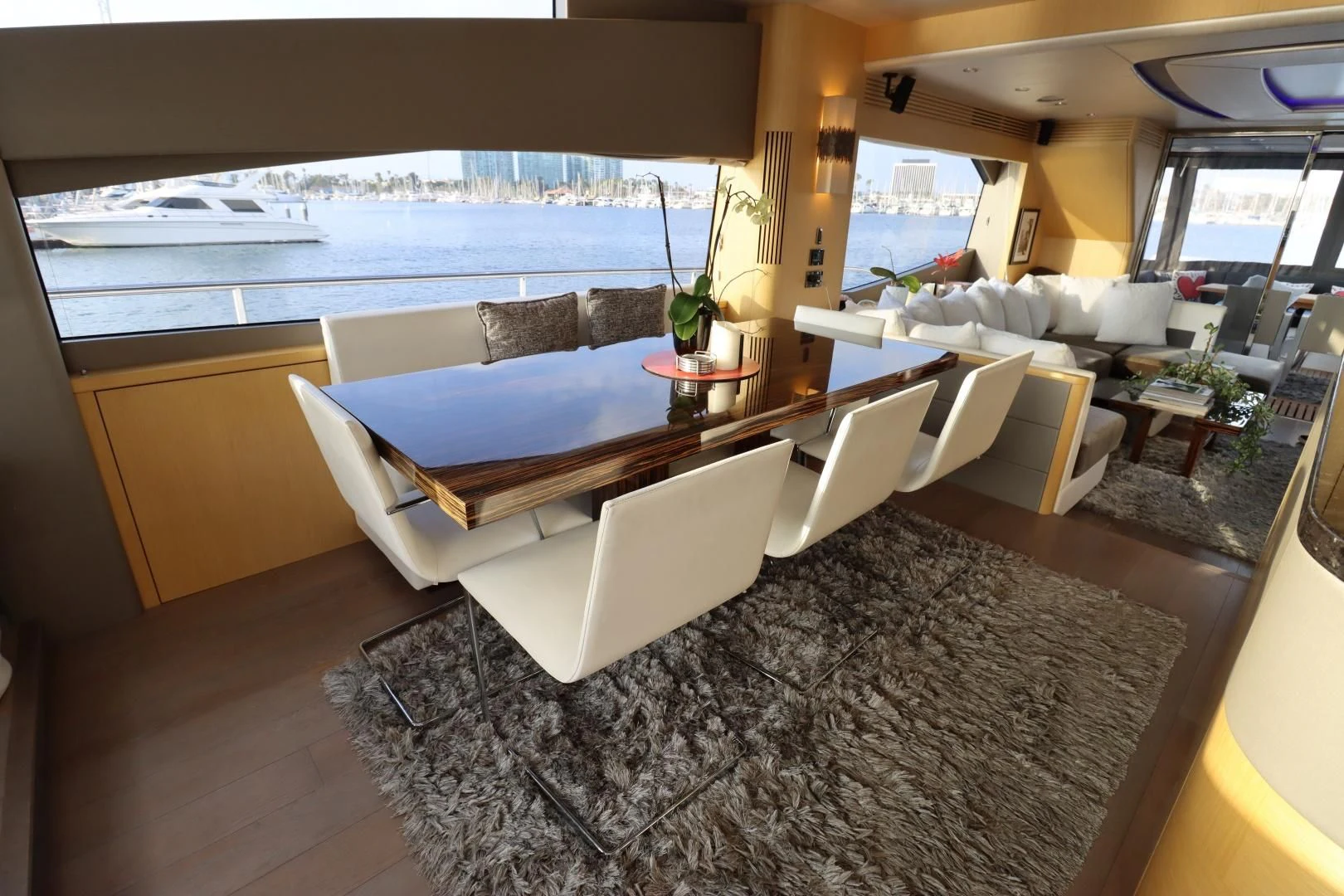a room with a large couch and a large pool aboard MOJO RISIN Yacht for Sale