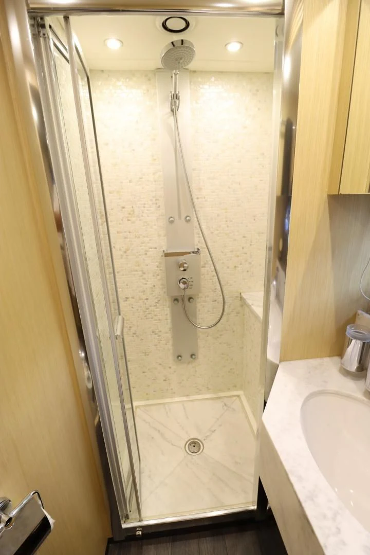 a shower with a glass door aboard MOJO RISIN Yacht for Sale
