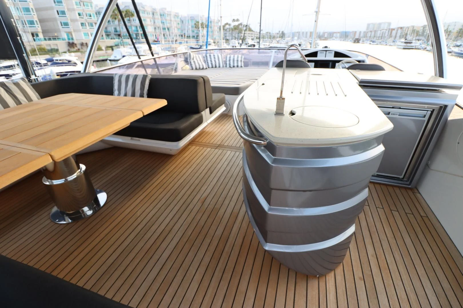 a white cylinder on a wooden surface aboard MOJO RISIN Yacht for Sale