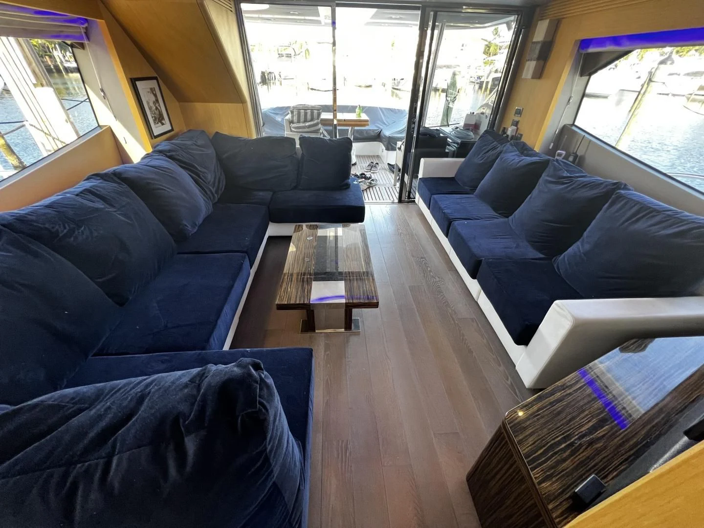 a living room with a wood floor aboard MOJO RISIN Yacht for Sale