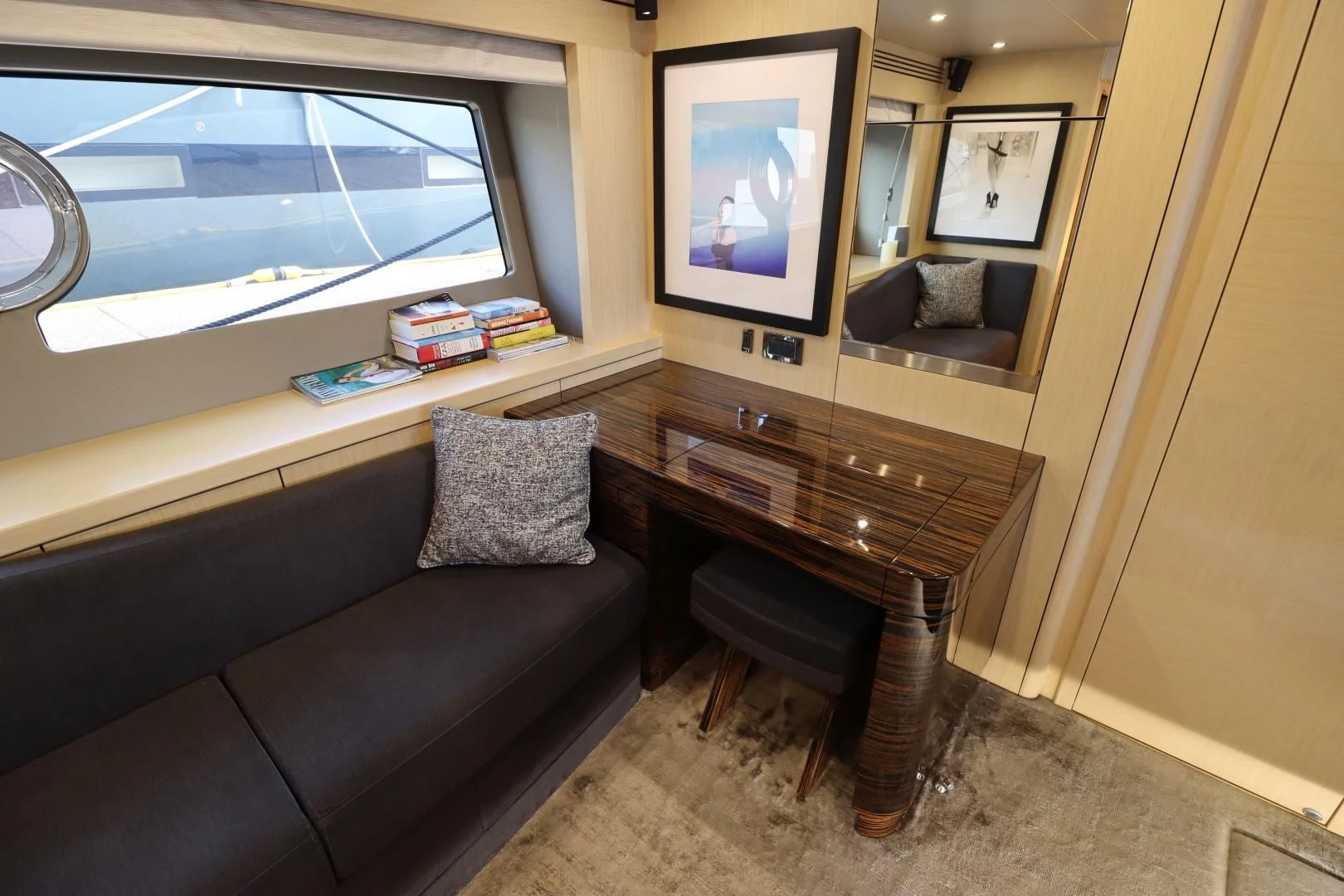 a living room with a couch and a tv aboard MOJO RISIN Yacht for Sale