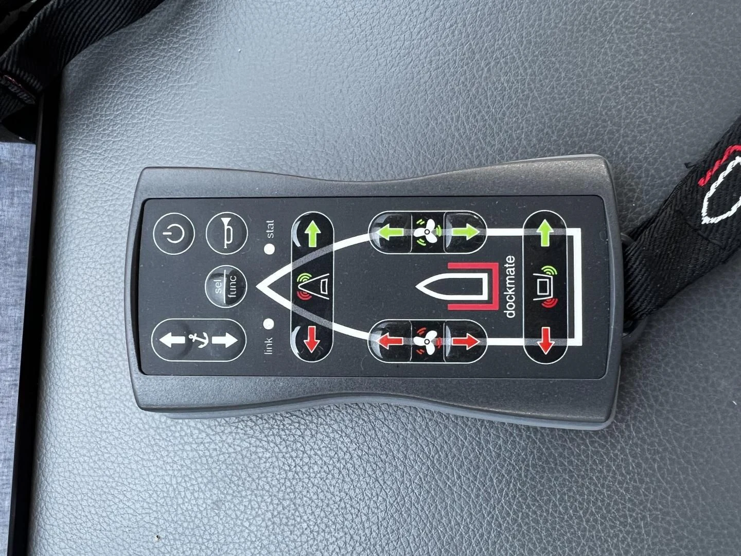 a remote control on a car seat aboard MOJO RISIN Yacht for Sale