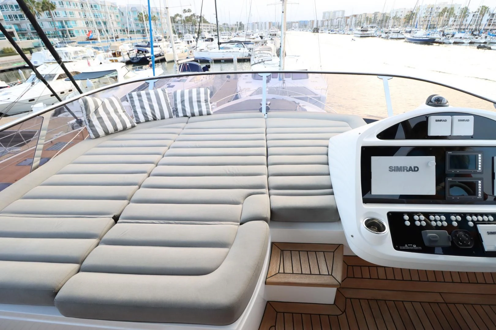 a deck with a screen and a boat in the background aboard MOJO RISIN Yacht for Sale