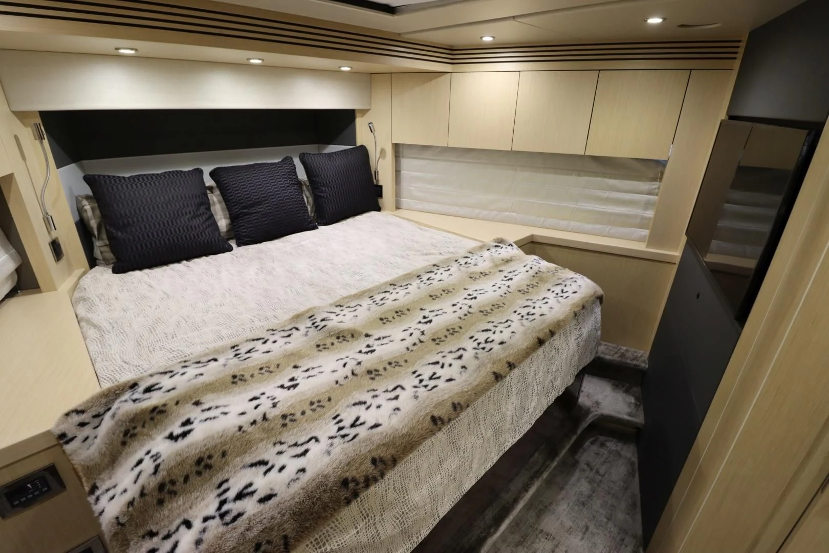 a bed with a white sheet aboard MOJO RISIN Yacht for Sale