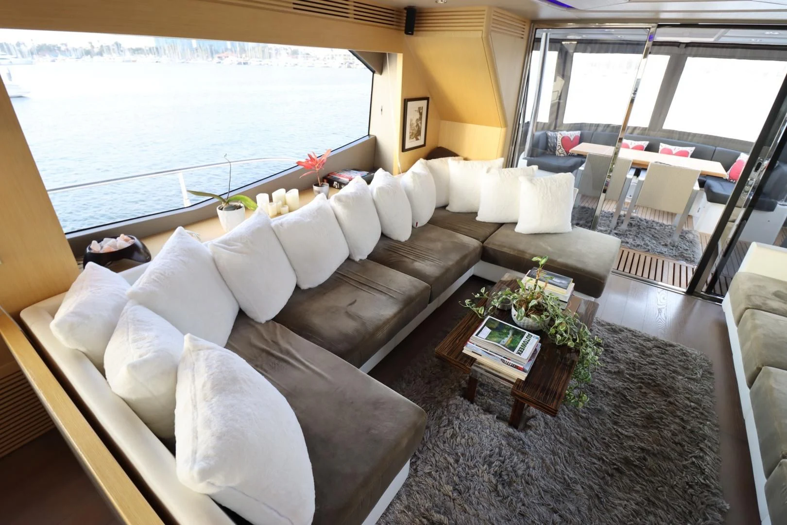 a living room with a large window aboard MOJO RISIN Yacht for Sale