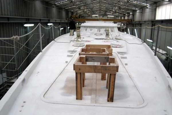 a wooden table on a white platform aboard GARCIA 110 Yacht for Sale