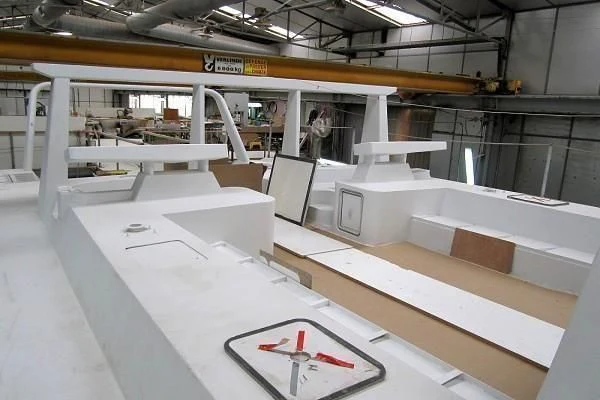 a large white table with a clock on it aboard GARCIA 110 Yacht for Sale