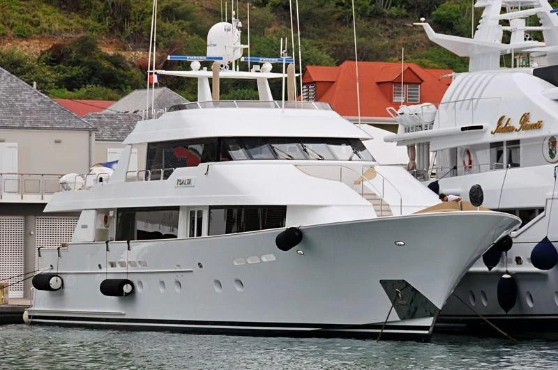 a white yacht on the water aboard TSALTA Yacht for Sale