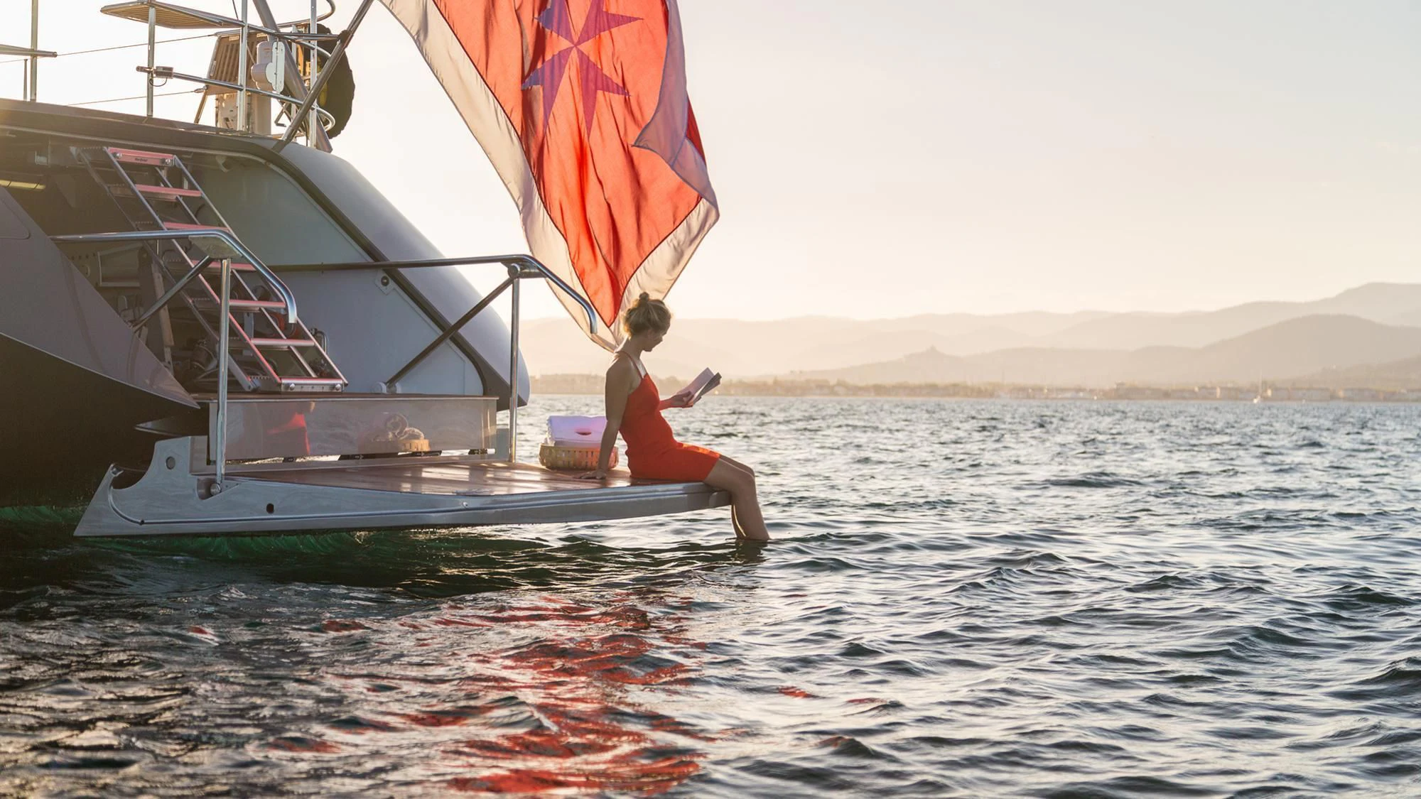 a person jumping into the water aboard SWAGGER Yacht for Sale