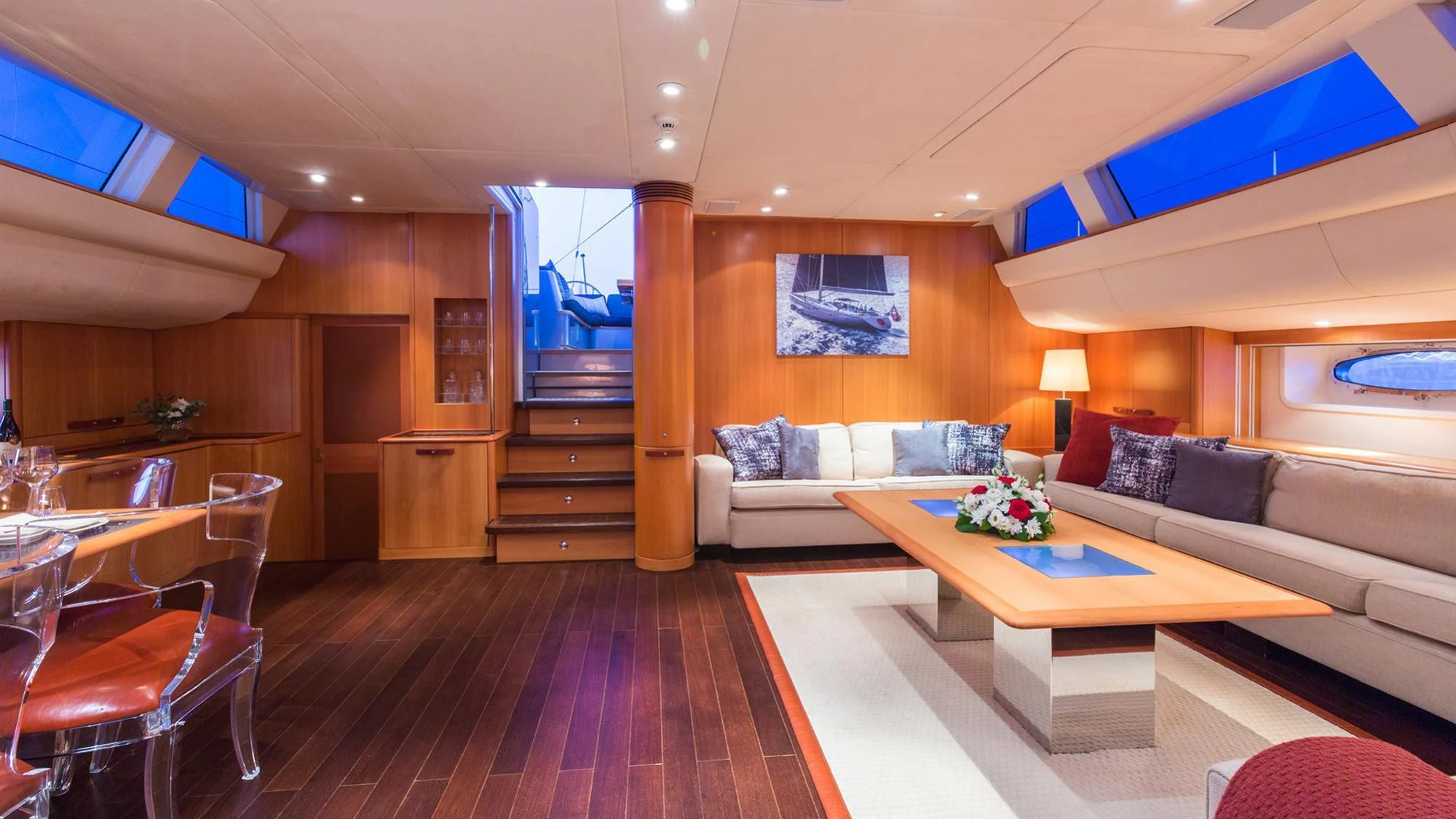 a living room with a couch and a table aboard SWAGGER Yacht for Sale