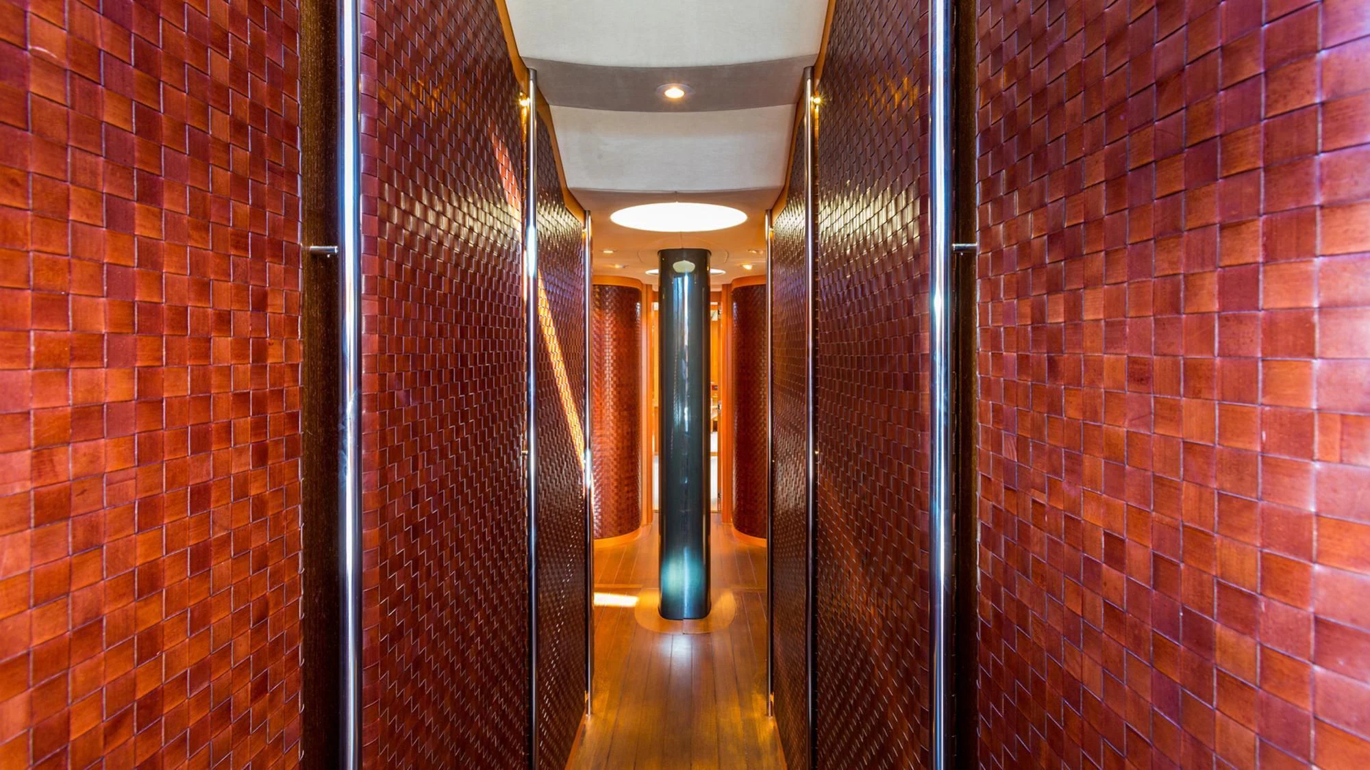 a hallway with a brick wall aboard SWAGGER Yacht for Sale