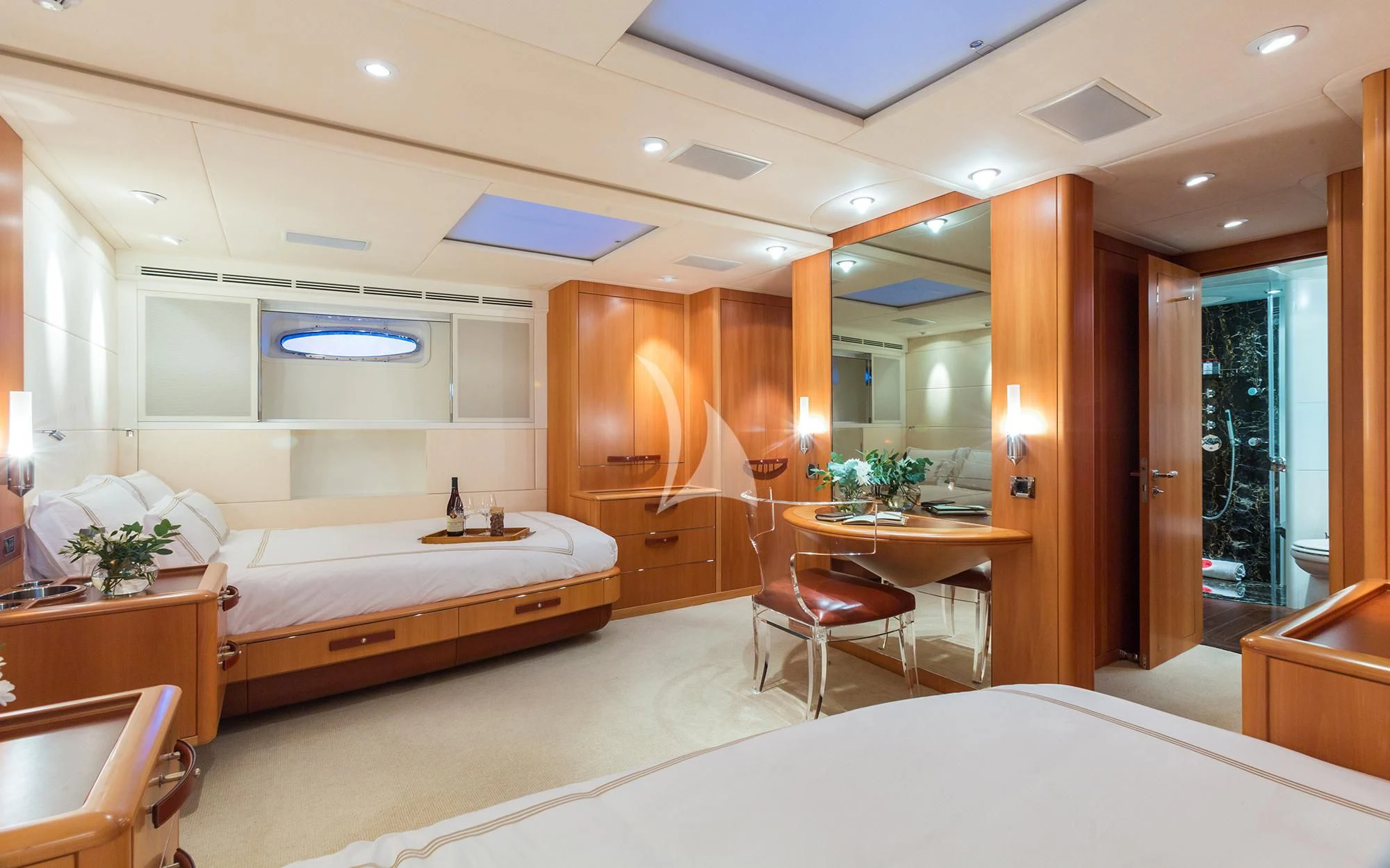 a hotel room with a bed and desk aboard SWAGGER Yacht for Sale