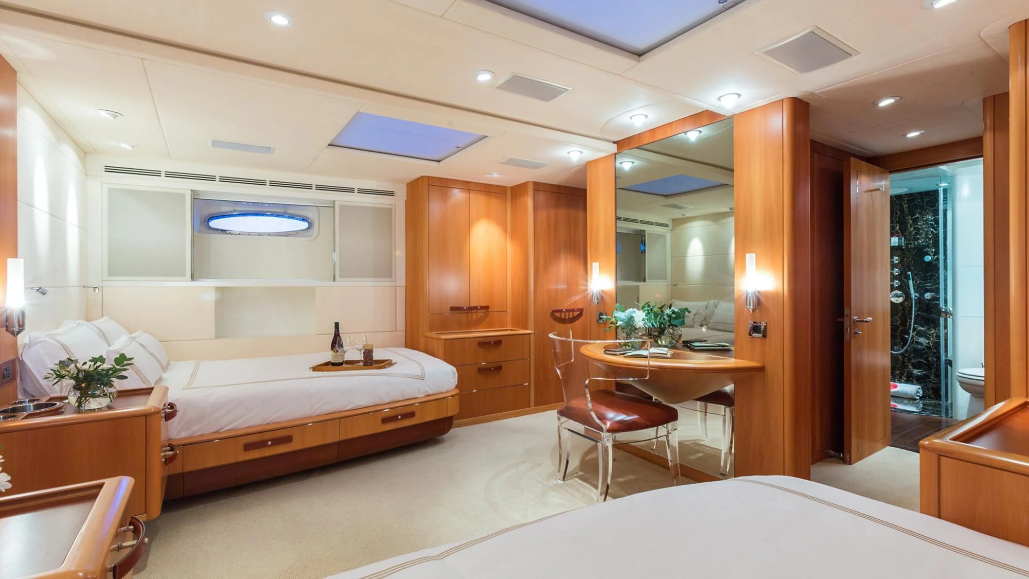 a hotel room with a bed and desk aboard SWAGGER Yacht for Sale