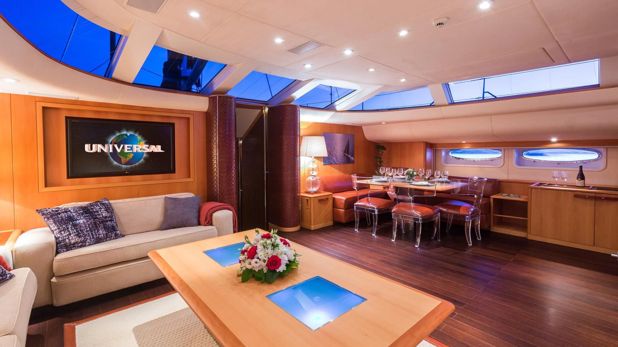 a room with a couch and a table and chairs aboard SWAGGER Yacht for Sale