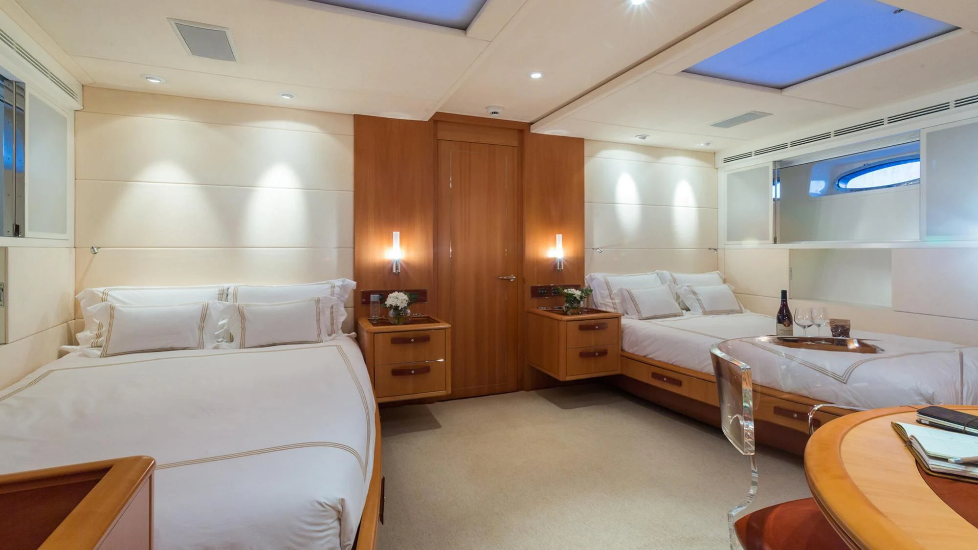 a room with a bed and a desk aboard SWAGGER Yacht for Sale