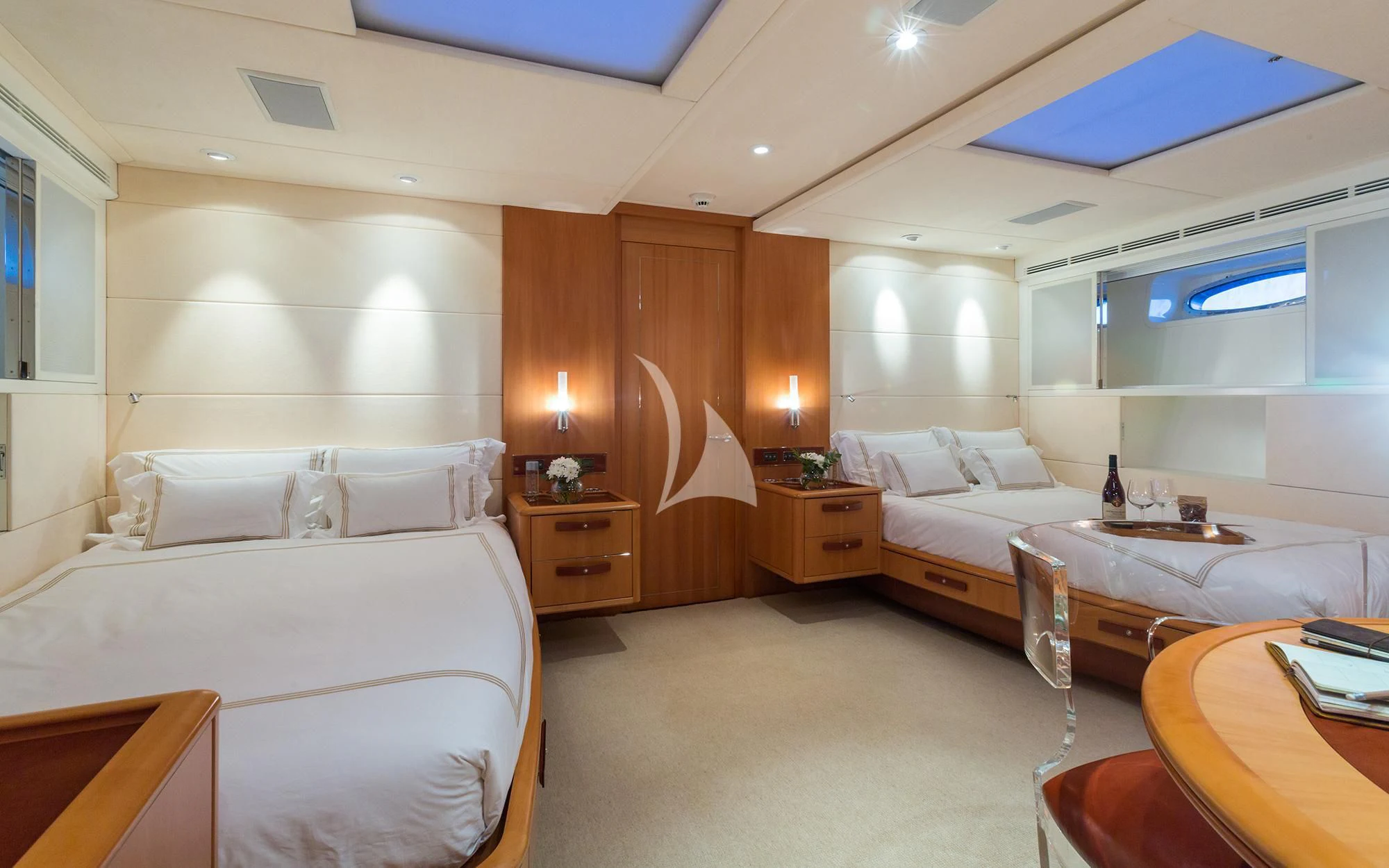 a room with a bed and a table aboard SWAGGER Yacht for Sale