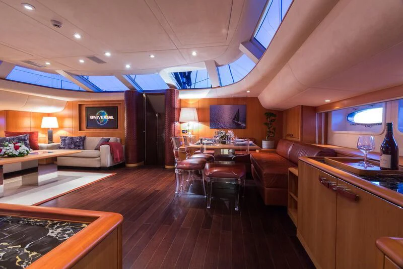 a living room with a wood floor aboard SWAGGER Yacht for Sale