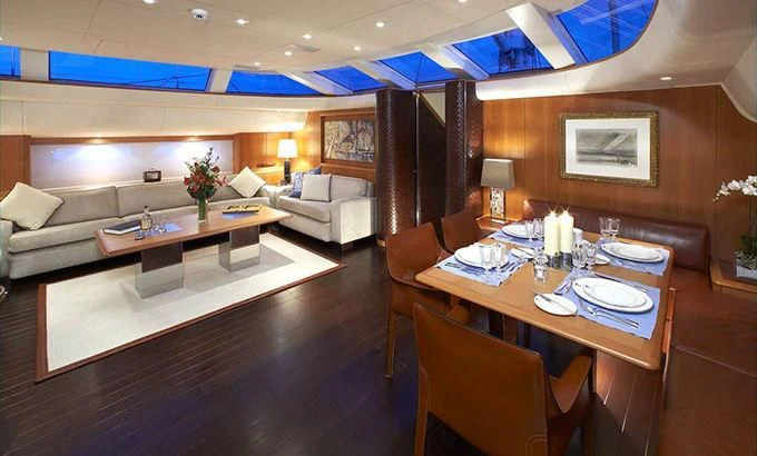 a room with a table and chairs aboard SWAGGER Yacht for Sale