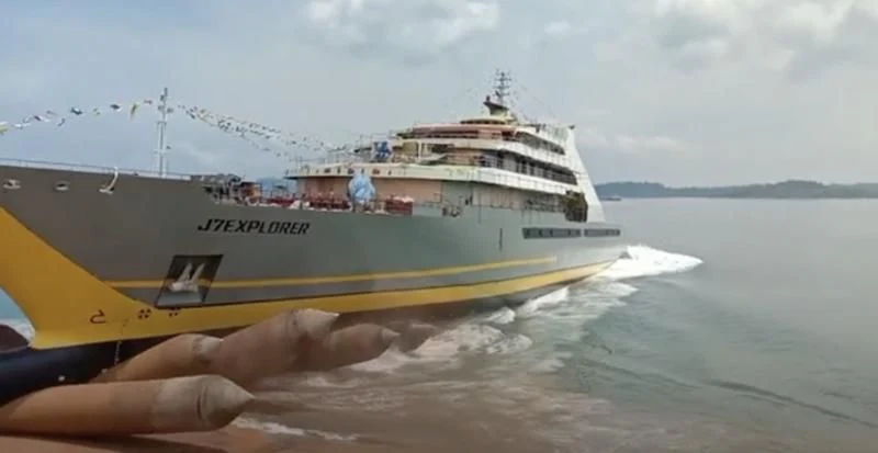 a person's hand on a boat in the water aboard J7 EXPLORER Yacht for Sale