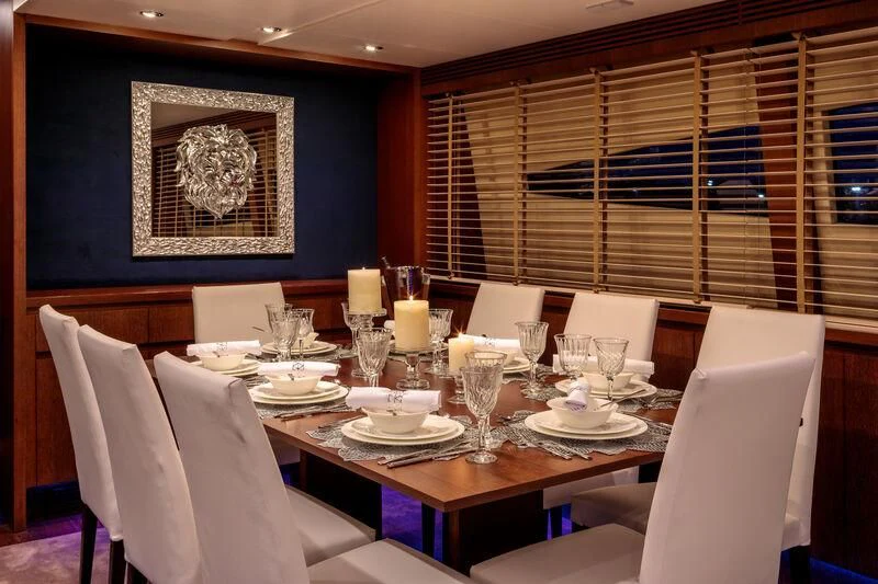 a dining room with a table set aboard MIRAVAL Yacht for Charter