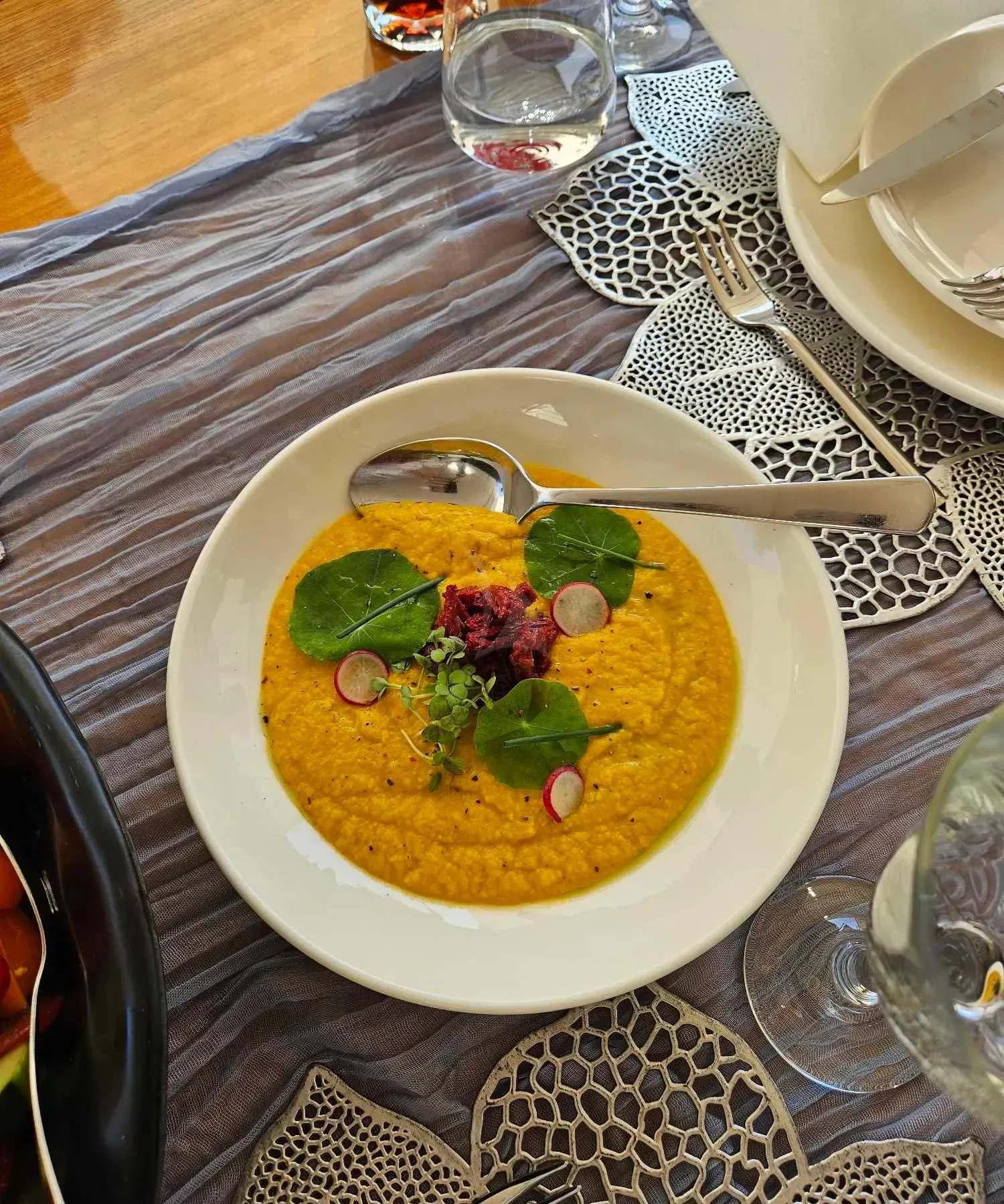 a bowl of soup on a table aboard MIRAVAL Yacht for Charter