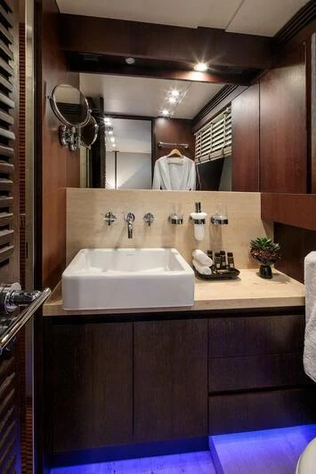 a bathroom with a sink and a mirror aboard MIRAVAL Yacht for Charter
