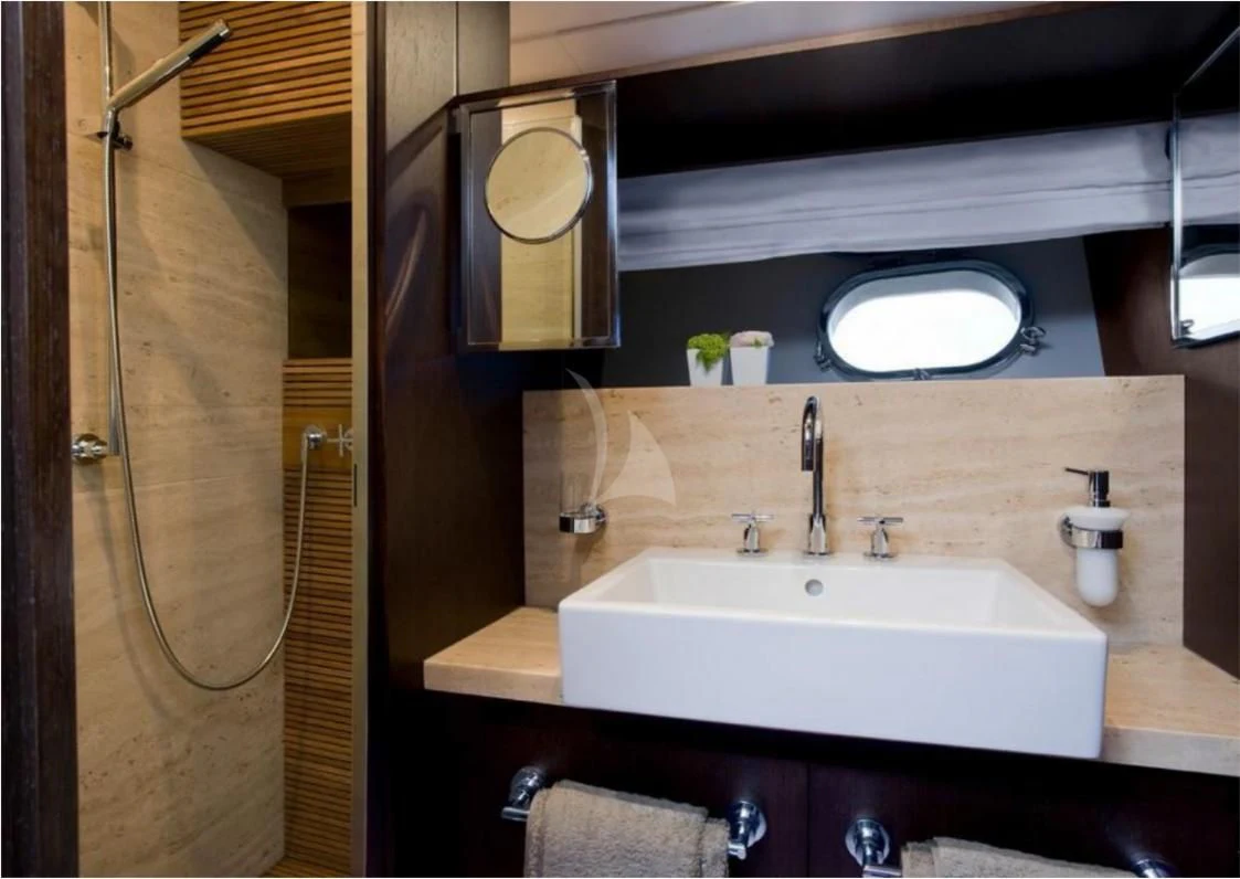 a bathroom with a sink and a mirror aboard MIRAVAL Yacht for Charter